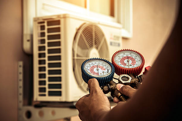Professional Heat Pump Repair technician working in Stonewall, TX